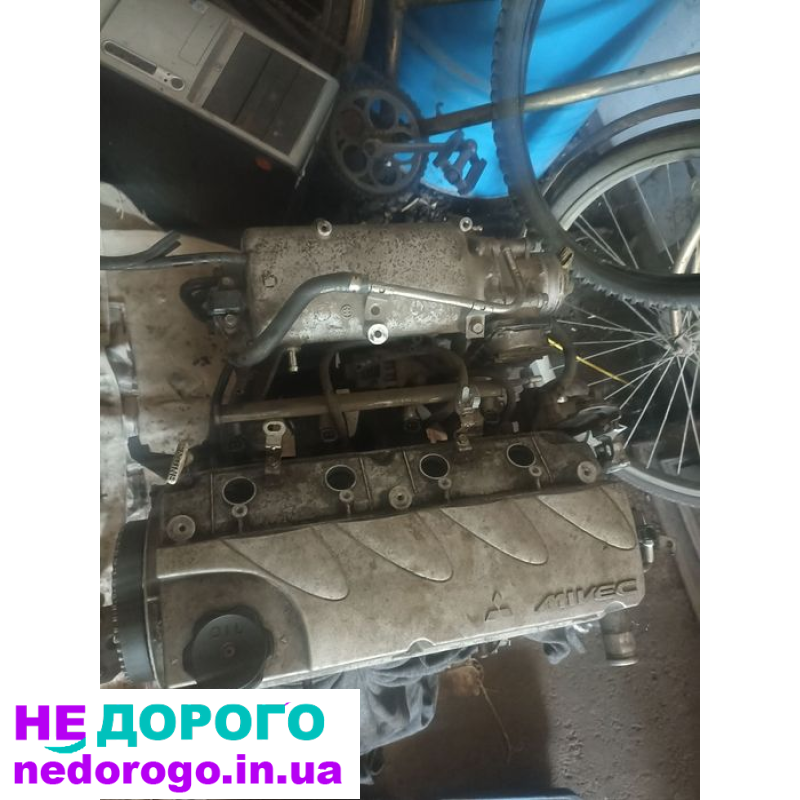Двигун Mitsubishi 4G69, встановлений на моделях Galant, Grandis та Outlander, випущений у 2004 році. Об'єм двигуна - 2.4 літра, працює на бензині.