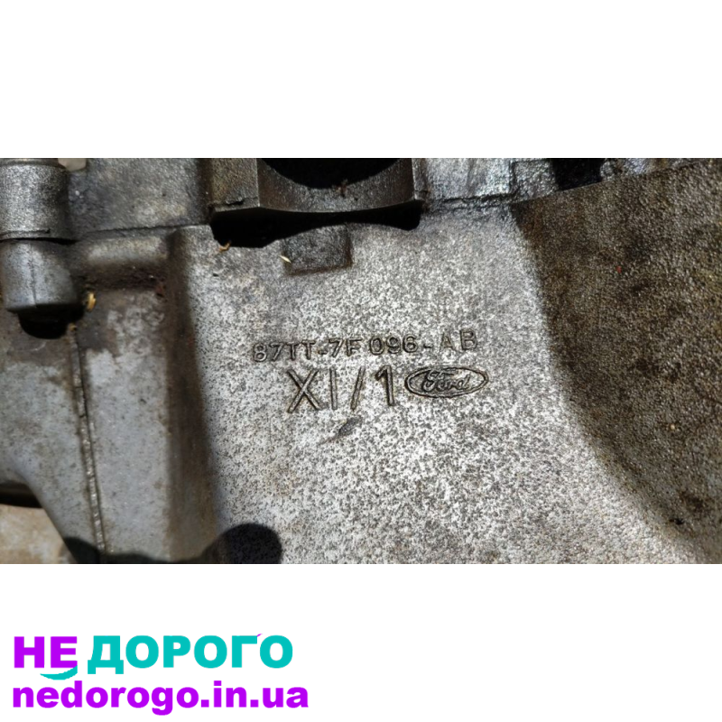Коробка передач Ford 87TT-7F096-AB для автомобіля Ford, випущена в 1987 році, об'єм двигуна - 2.0 літра, працює на бензині.