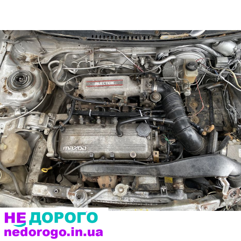 Мотор 1.6 інжектор Mazda 323 BG, об'єм двигуна 1.6 л, бензин, рік випуску не вказано.